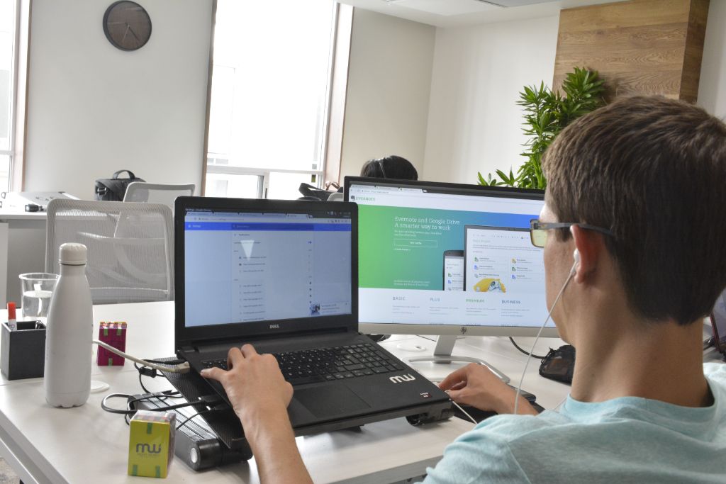 Daevo consultant focused on a coding task at his workstation